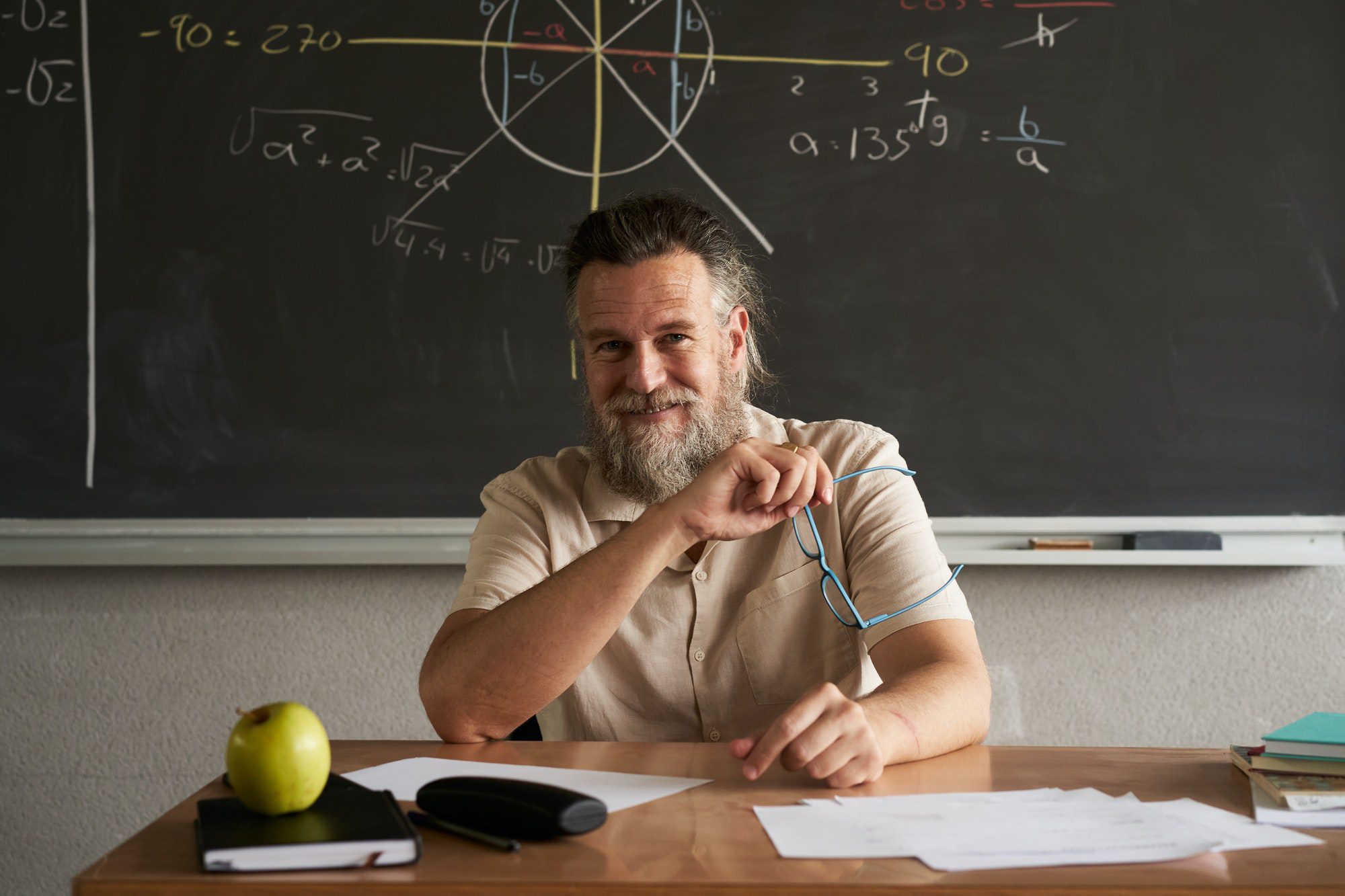Medicare Advantage Explained from a cheerful teacher looking at the camera