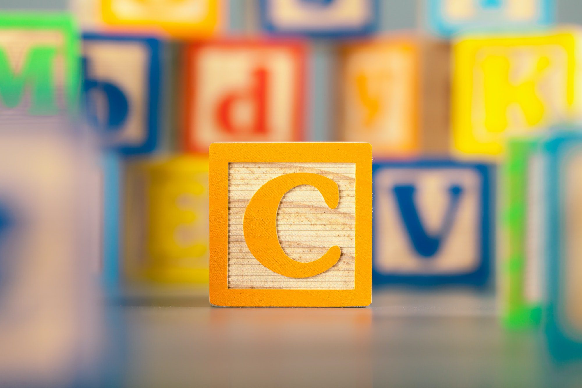 Photograph of colorful Wooden Block Letter C representing Medicare Part C plans work