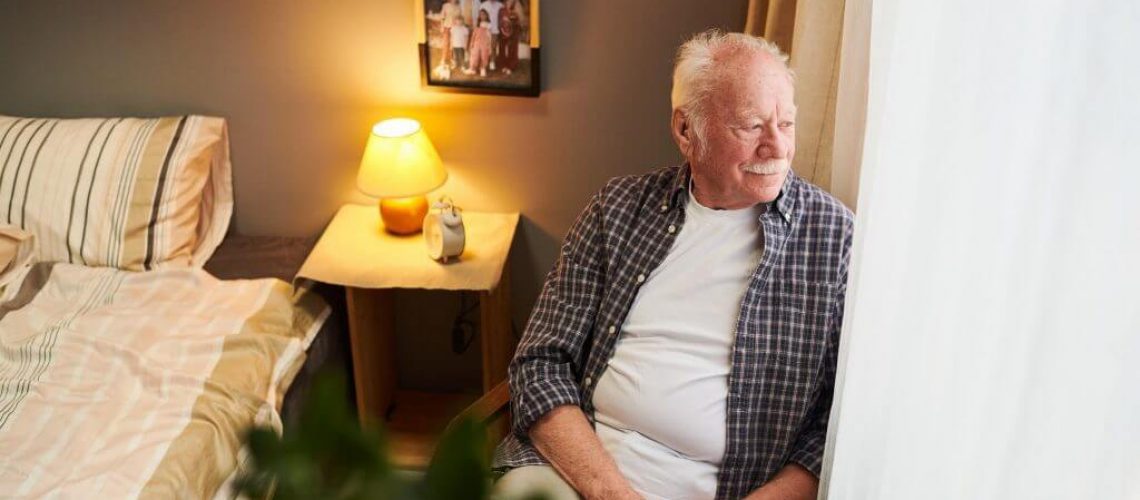 serene-and-relaxed-senior-man-sitting-in-armchair-by-window-1024x682